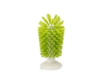 Grey double-headed cup cleaning brush with wall-mounted suction cups for kitchen use
