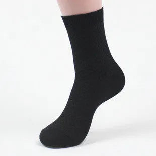 A pair of men's bamboo fibre ankle socks with a small square pattern, shown in one of the five available colours.