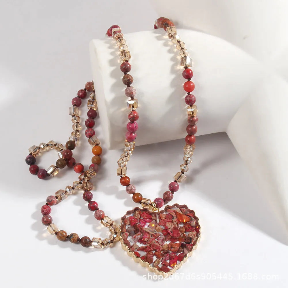 Bohemian style long chain heart pendant necklace in stone and glass with electroplated finish, available in multiple colours.