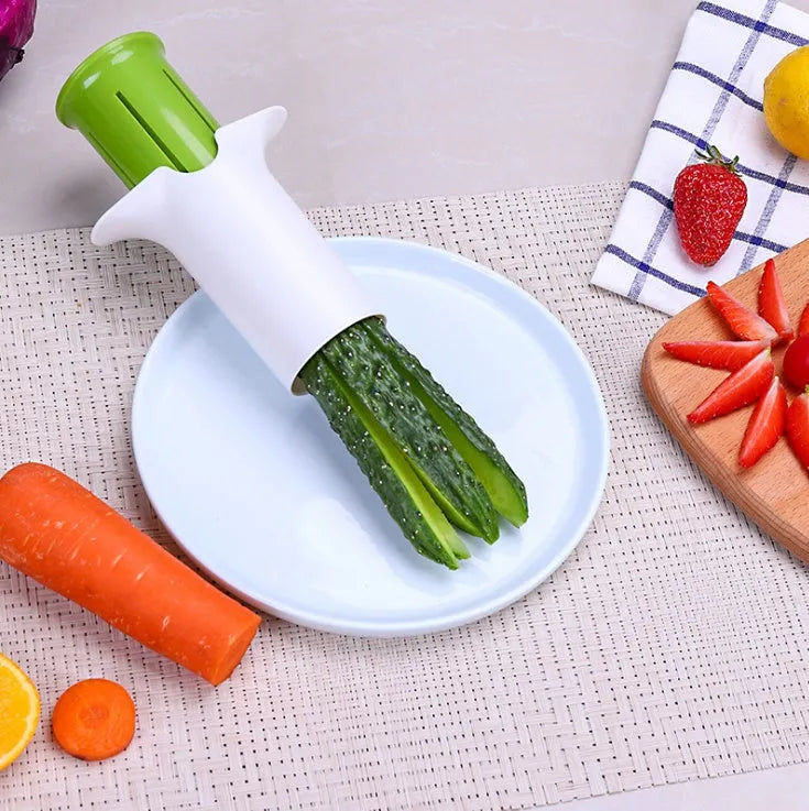 White kitchen vegetable slicer with six stainless steel blades for cucumbers and carrots.