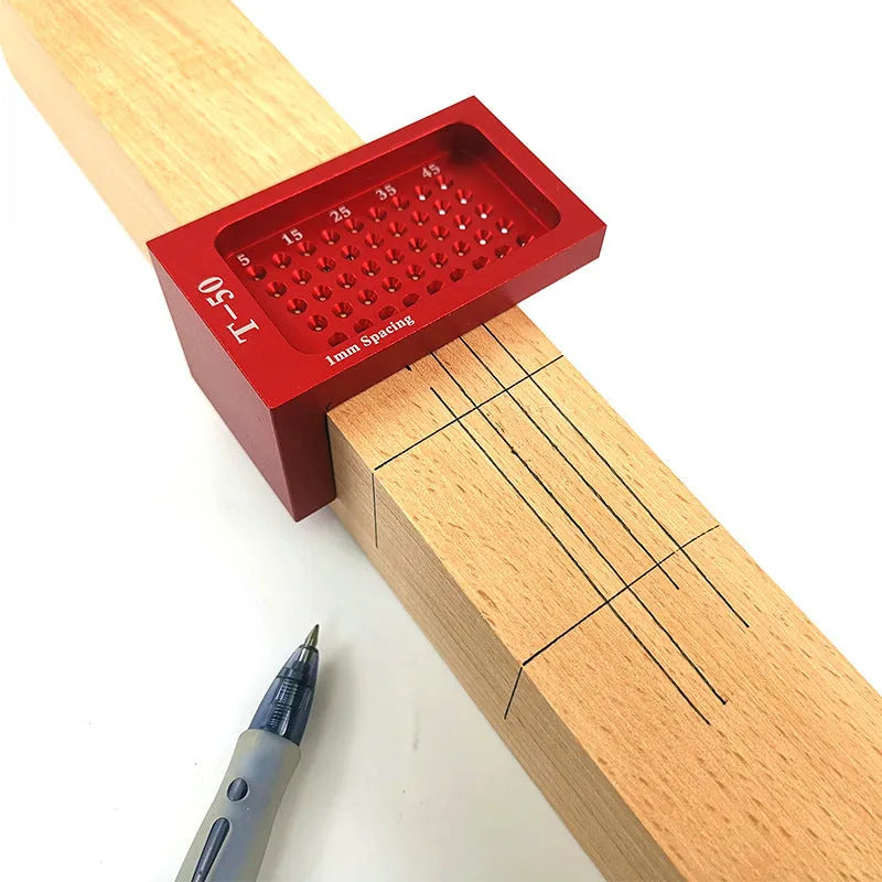 Red alloy steel T50 Mini Scribe woodworking ruler on a wooden workbench