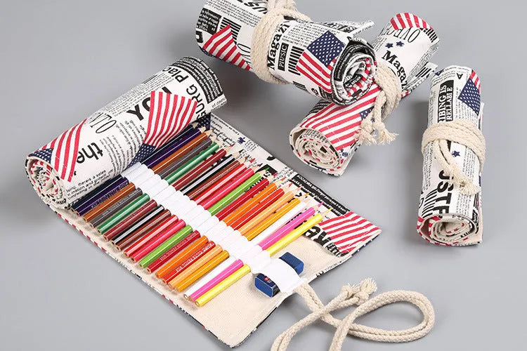 Canvas pencil wrap roll up case with multiple elastic bands holding pens and pencils, in a compact roll.