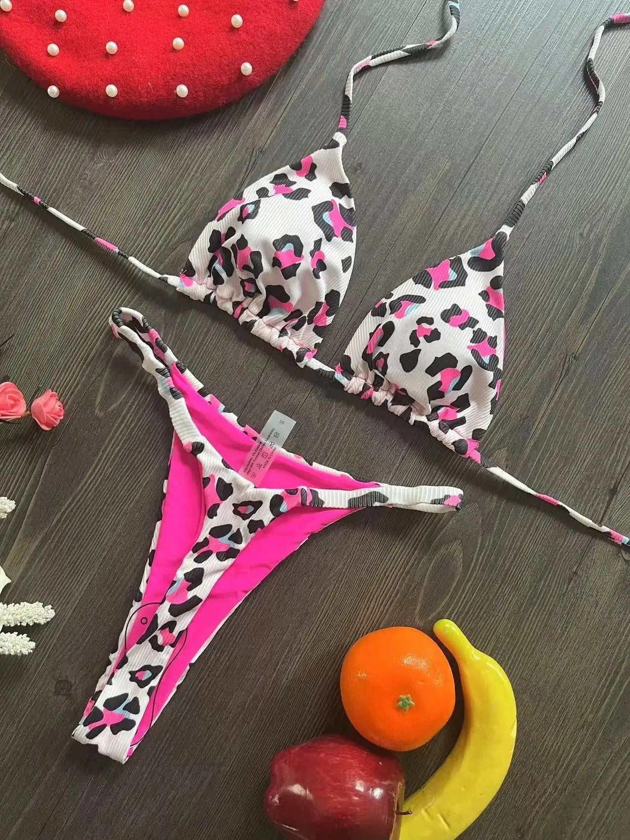 Women's printed bikini swimsuit with briefs style on a mannequin, showing the cotton lining and high elasticity fabric.