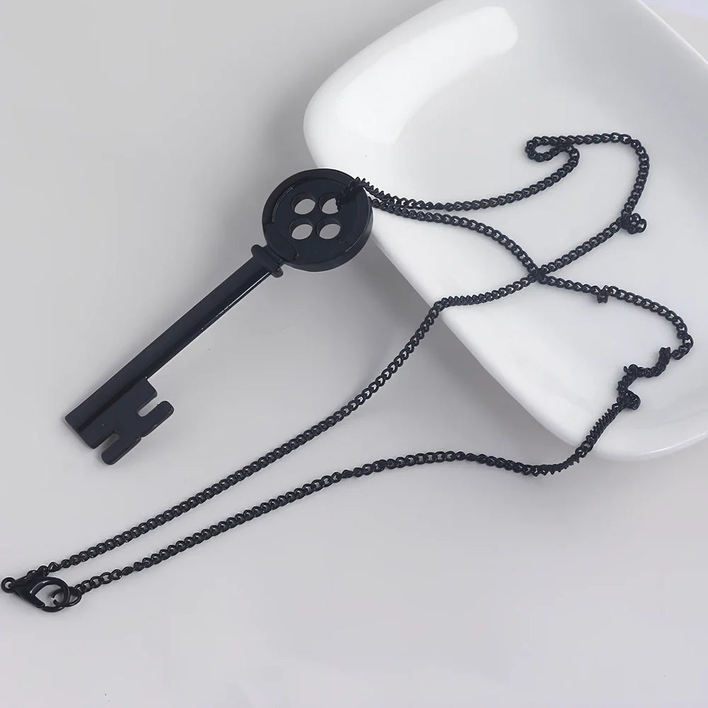 Unisex black key pendant necklace with star details on alloy chain, electroplated for durability, 45-50cm length