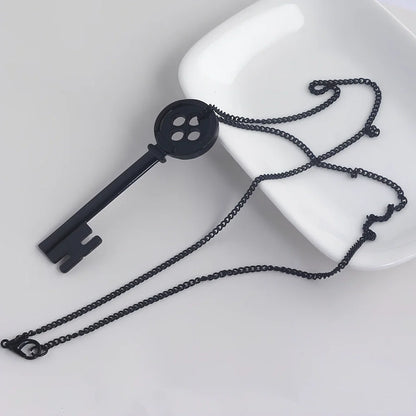 Unisex black key pendant necklace with star details on alloy chain, electroplated for durability, 45-50cm length