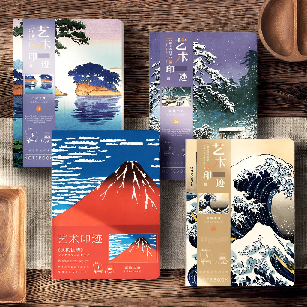 Ukiyo-e art hand ledger notebook open on a desk showing detailed Kanagawa wave cover and lined pages.