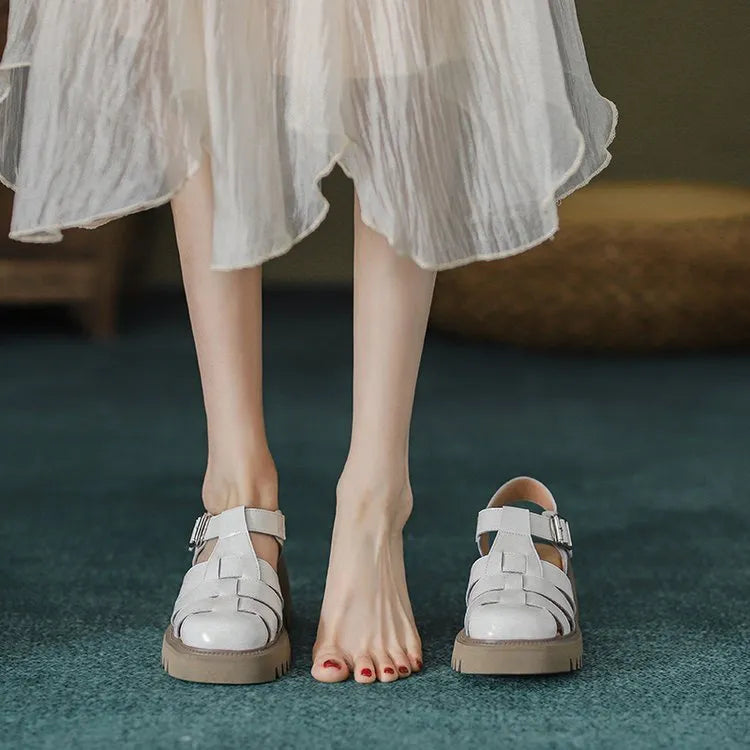 Women's retro platform sandals with chunky heel, closed round toe, and buckle strap in black and beige.