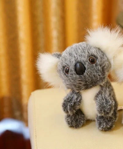 Soft plush koala doll with 100% PP cotton filling, available in 12cm, 16cm, 20cm, and 28cm sizes