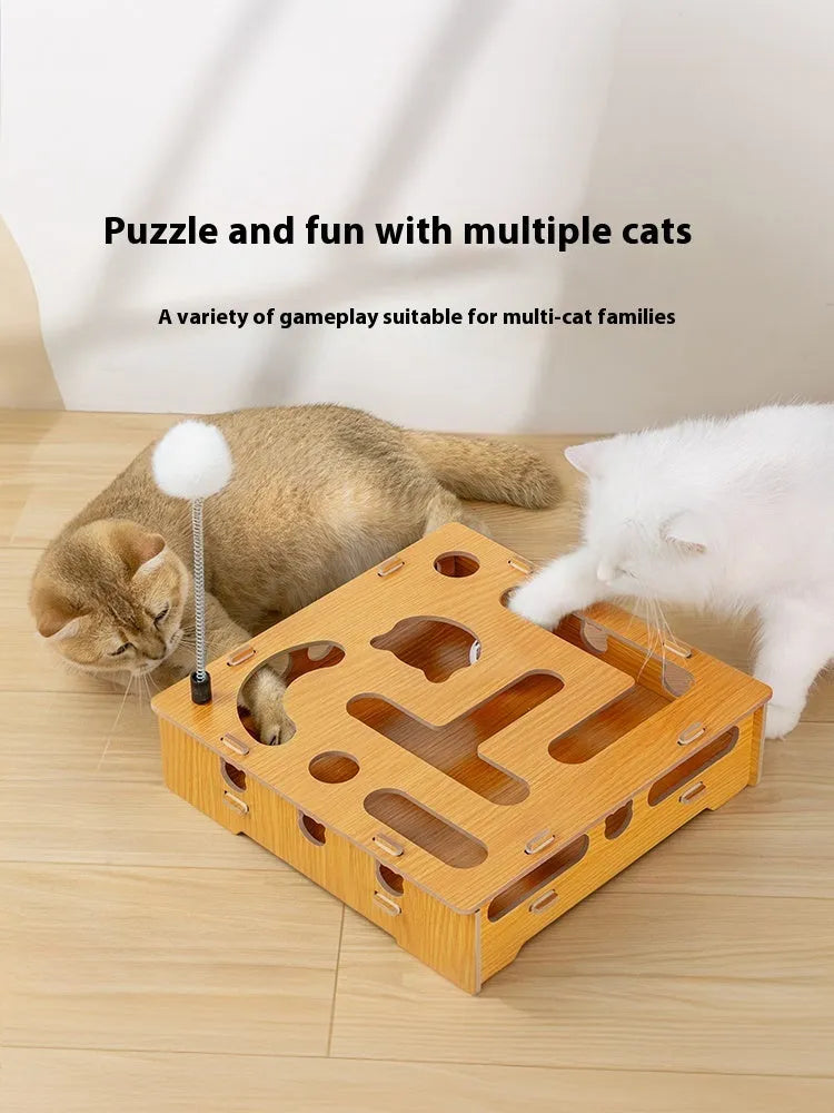 Wooden cat maze box with teasing stick and two bell balls on a floor