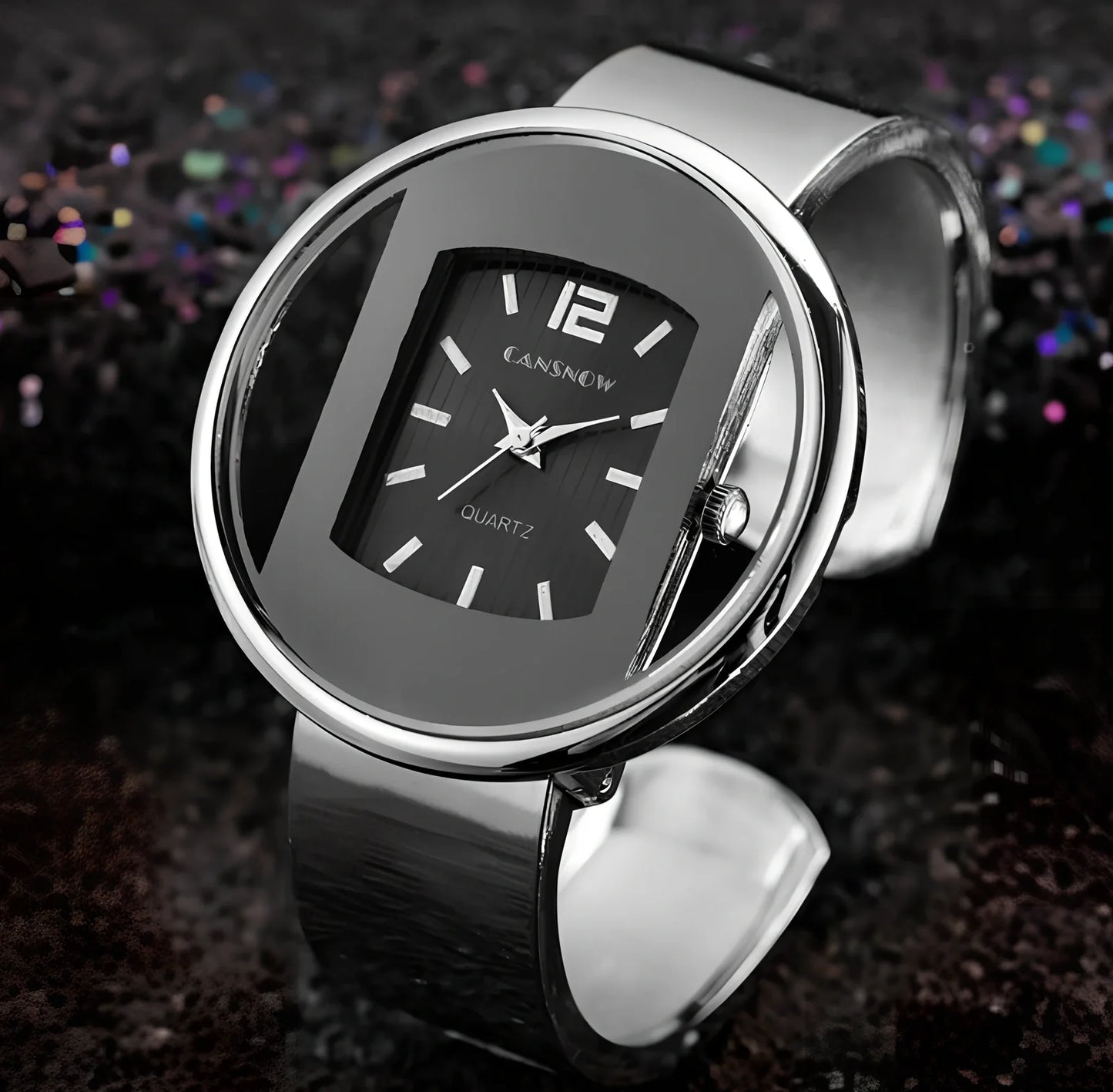 Women's gold black quartz cuff watch with 40mm dial, adjustable steel band 18mm wide, precise movement and water resistant