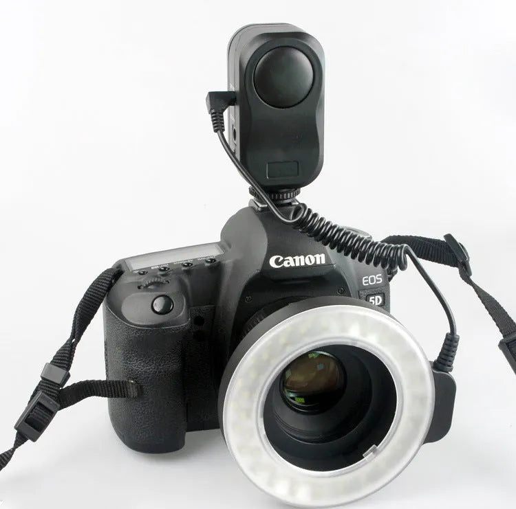 W48 LED ring light with 48 beads, six adapter rings, white and amber shades, on a table