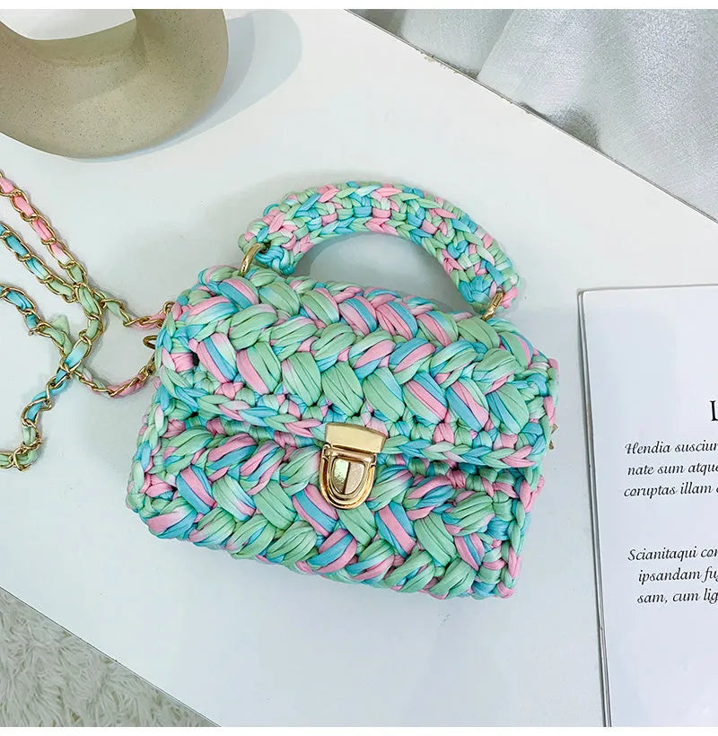 Hand knitted crochet cotton tote crossbody bag in Cotton Candy colour, horizontal square shape with lock closure and shoulder strap.