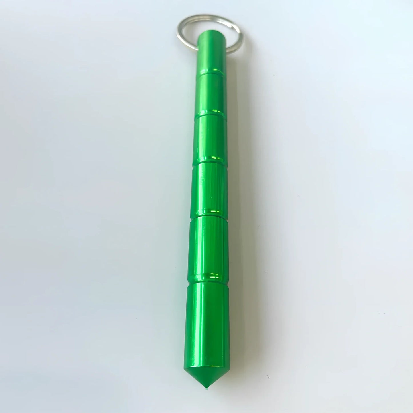 Green wrist strap self-defence key chain with perfume bottle, window breaker, alarm, and stick attachments, 10cm holder