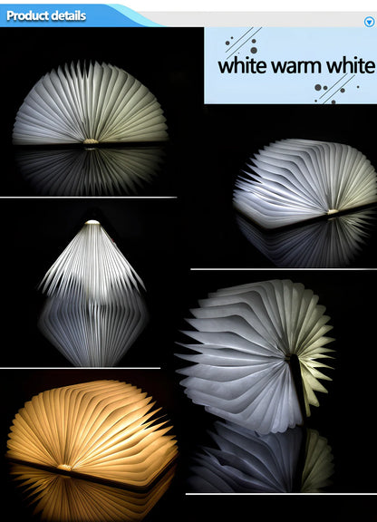 Wooden folding LED book light in walnut finish, open to 360 degrees showing warm white illumination on Tyvek pages, 21.5cm size