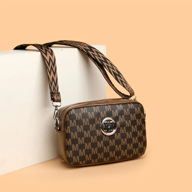 Women's synthetic leather crossbody bag with wide shoulder strap and three-dimensional front pocket