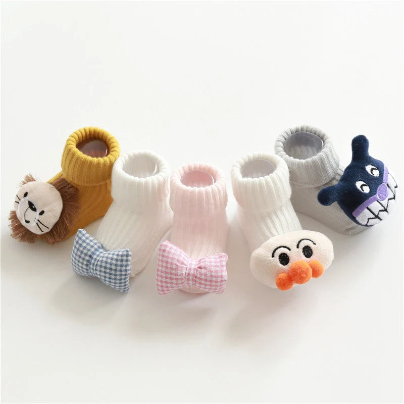 Cotton baby socks in various designs for newborns to 3-month-olds