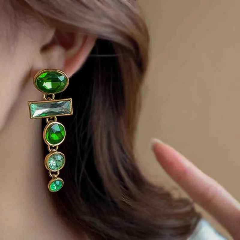 A pair of geometric-shaped green gradient earrings with zircon stones and a tassel, in a Chinese style.
