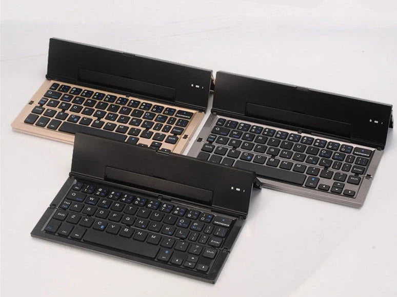 Folding ultra-thin Bluetooth keyboard in grey, rose gold, silver, and gold options