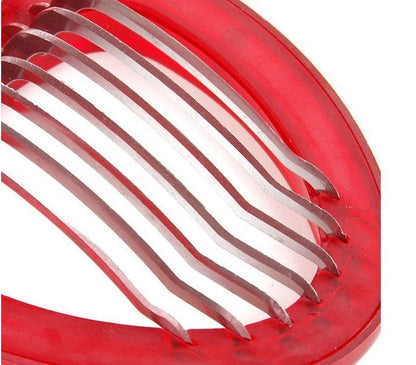 Red strawberry slicer with stainless steel blades for efficient and uniform fruit slicing