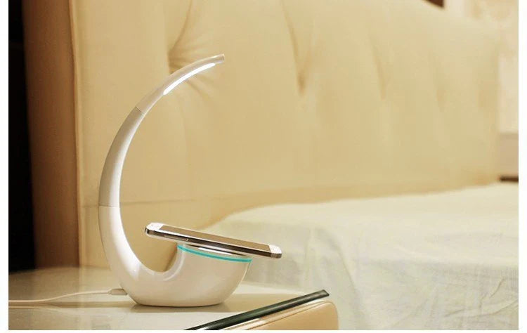 Wireless Qi charging lamp with sleek radian design, touch controls, and LED lighting