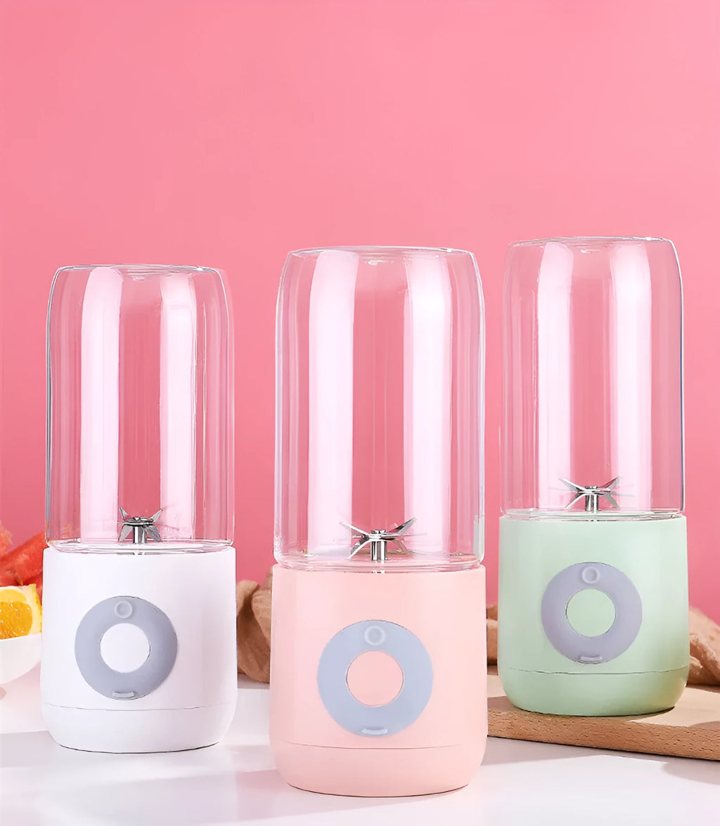 Mini USB automatic juicer in pink white and green colours with compact design 7x7x19.5cm