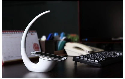 Wireless Qi charging lamp with sleek radian design, touch controls, and LED lighting