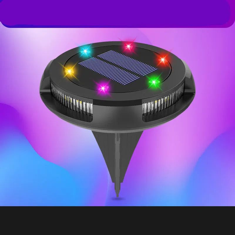 LED solar underground lawn light 11x4x13cm black ABS PP with seven colour changing cold white light on grass at dusk