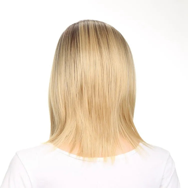 Short straight wig in gold colour, 16 inch length, on a mannequin head