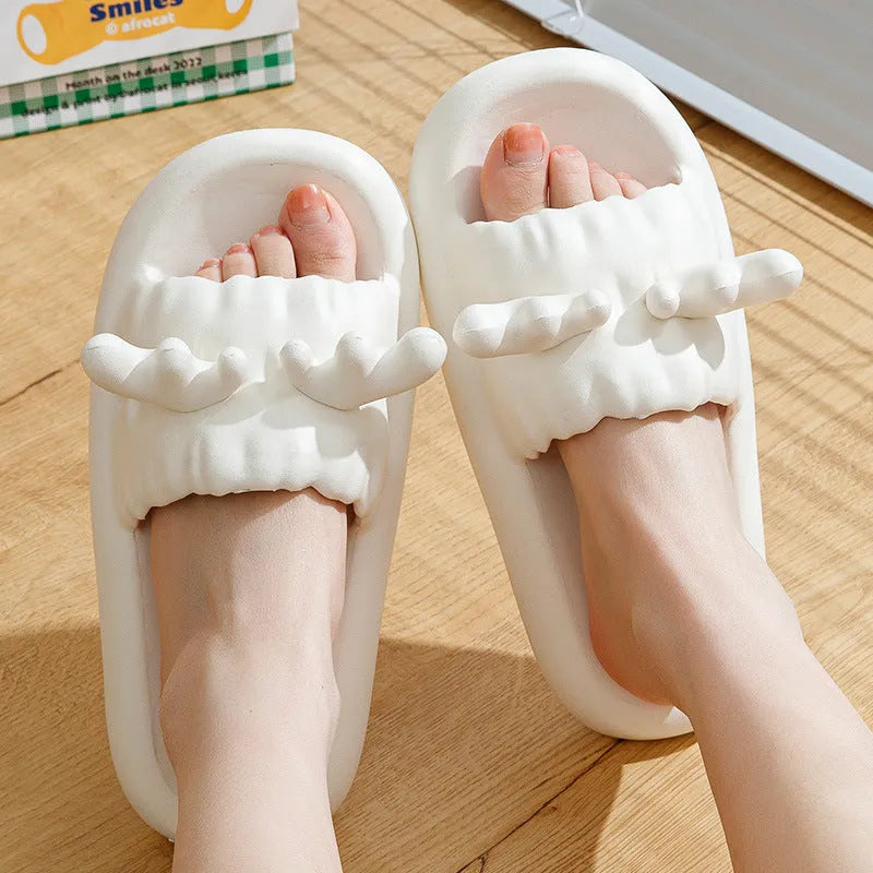 Women's flip-flop style slippers with deer horn design, shown in light yellow on a non-slip EVA sole.