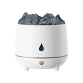 Black or white volcano-shaped USB humidifier on a table, emitting mist.