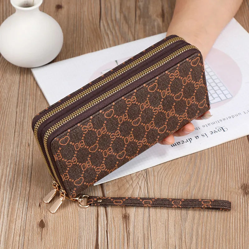 Long black PU leather wallet clutch with print detail showing mobile phone compartment and coin purse