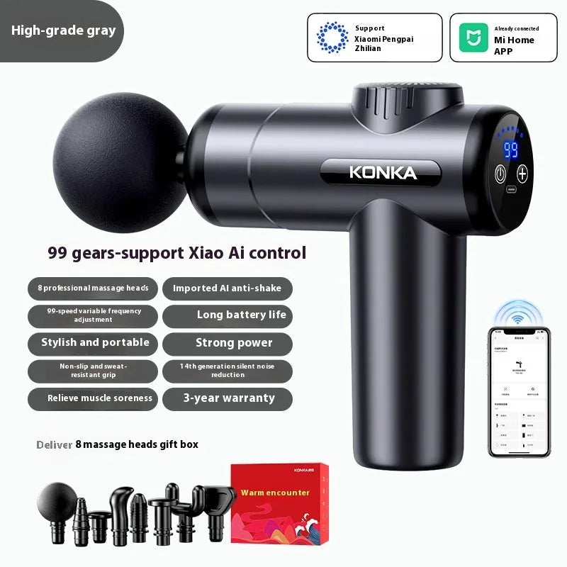 Konka grey mini electric massage gun with six different coloured massage heads on a table.