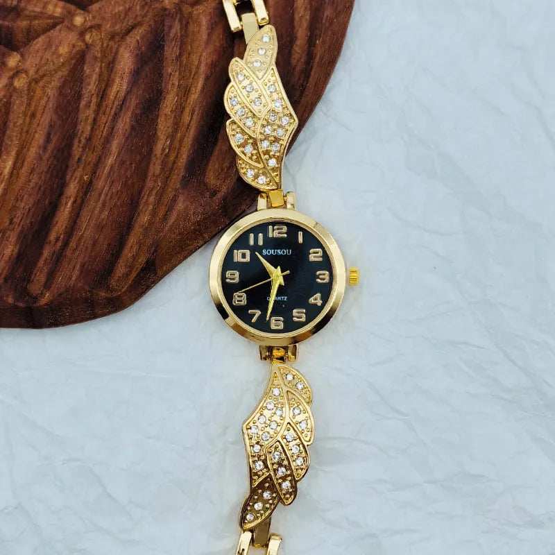 Stainless steel women's watch with round dial on a metal strap with Vachette clasp, shown in gold colour.