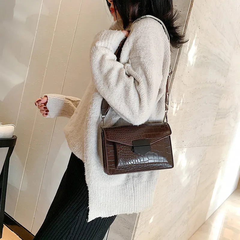 Vintage style PU crossbody bag in black, shown with dimensions for mobile phones and wallets