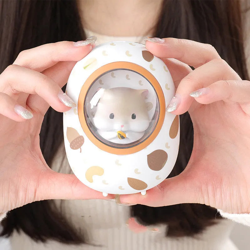 White Hamster brand hand warmer and power bank with 5000mAh capacity on a plain background.
