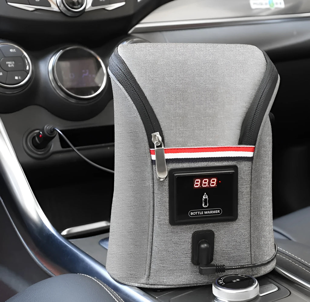 Grey Oxford cloth portable baby bottle warmer with electronic display and car charger, shown next to two baby bottles.