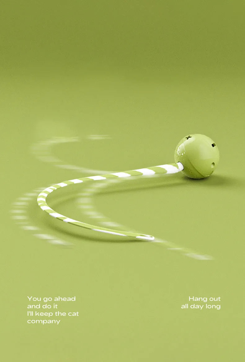 Green electric wagging tail cat ball toy on floor with motion sensor for interactive play