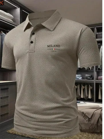 Man wearing a solid colour short-sleeved polo shirt with a formal lapel collar, loose fit.