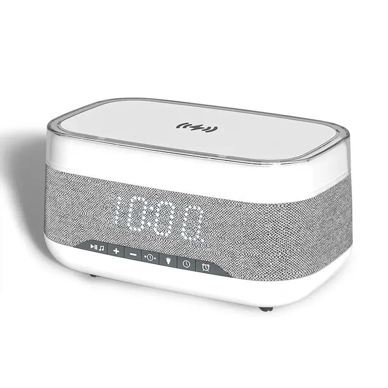 White multifunctional alarm clock with Bluetooth speaker and wireless charging pad for mobile phones