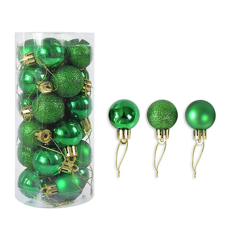 Set of shiny matte finish red and gold plastic Christmas tree baubles, 3cm diameter, on a green branch.