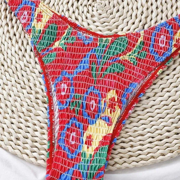 Red floral pattern women's underwire triangle bikini with briefs-style bottom on mannequin