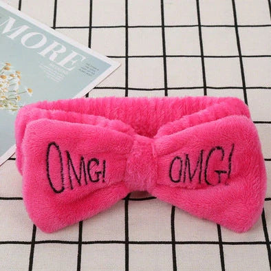 Coral velvet butterfly end hair band in pink with text styling, showing butterfly ends and cloth material