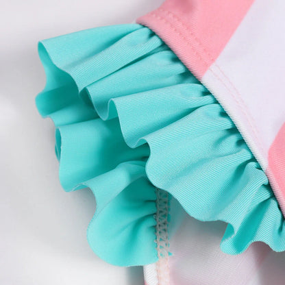 Pink baby girl's swimming suit with floral patterns, size L, for ages 18 months to 9 years