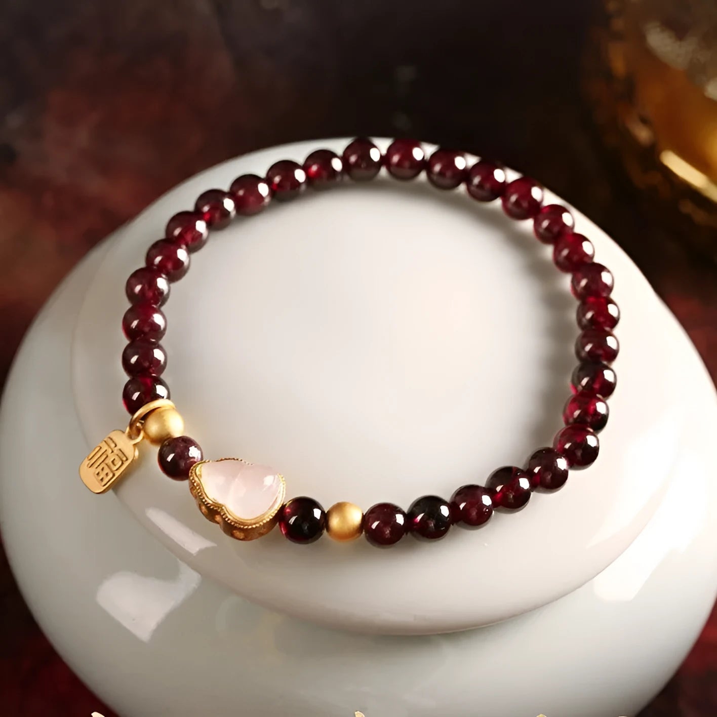 Chinese style gourd bracelet with imitation garnet beads and traditional Fu character charm on adjustable U-shaped design
