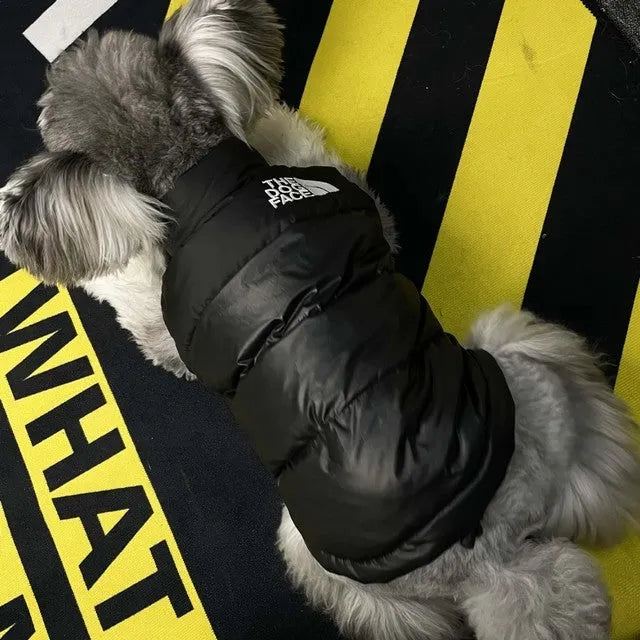 Thick warm down vest for dogs in black, showing side view, sizes S to XXL
