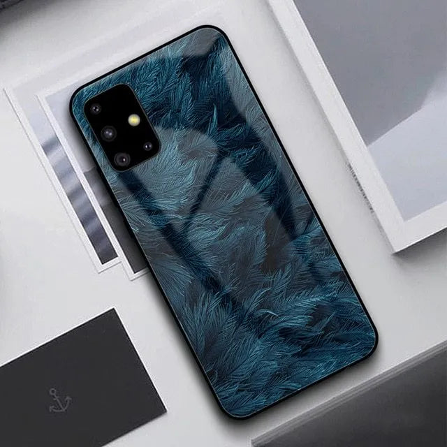 A black silicone protective case for a smartphone, shown next to a navy blue version.