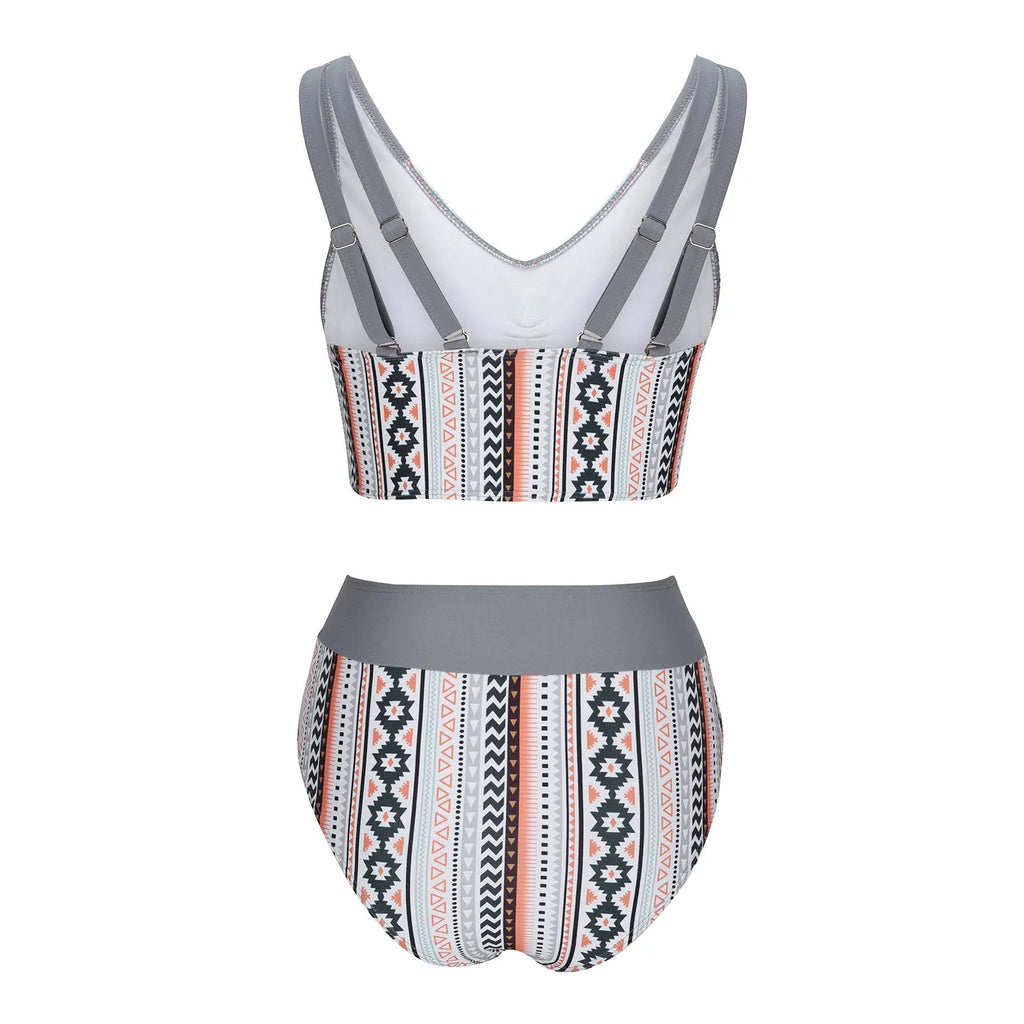 Solid colour women's cross sling split swimsuit in brief style made from polyester fabric.