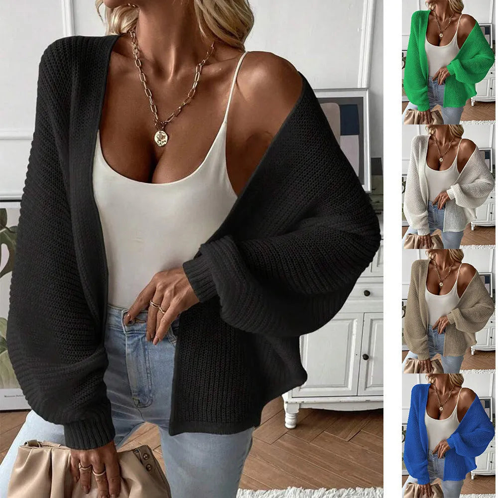 Women's loose-fit batwing sleeve cardigan in solid colour, made from thin polyester fabric.