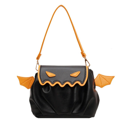 Halloween pumpkin cartoon crossbody bag with wings in black, white, and orange