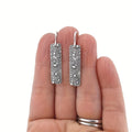 Silver geometric long drop earrings with carved vine patterns and retro design
